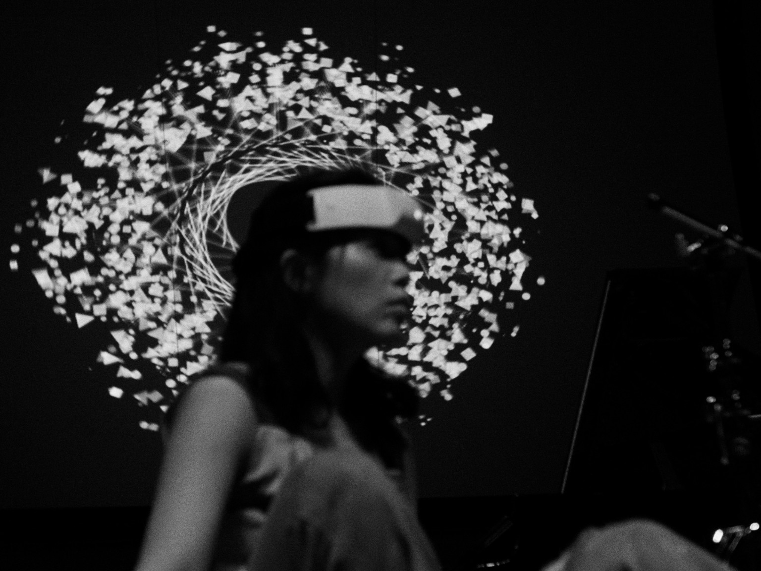 Performer fitting a neural sensing device on a participant