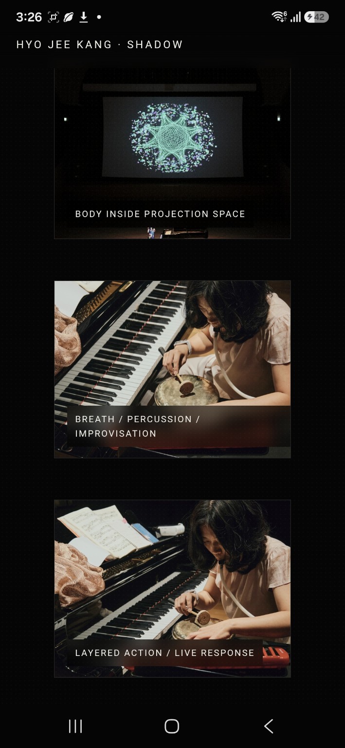 Performer framed by a dark projected generative field